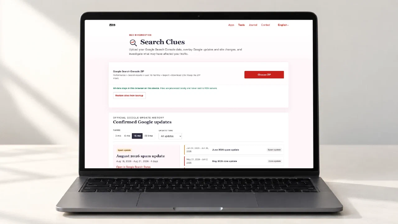 A laptop displaying the actual Search Clues page, with its Search Console ZIP import and confirmed Google update list.
